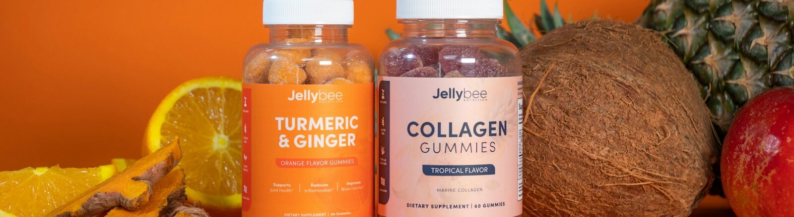 3 glass bottles on brown wooden table