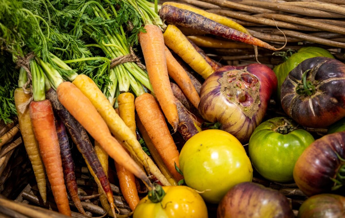 Colorful carrots, onions and tomatoes, vegetables containing carotenoid pigments